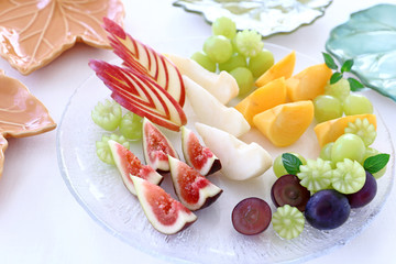 Autumn assorted fruits on a glass platter 