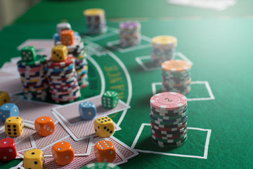 Casino equipment placed on the green floor for risky gambling for the people who want to get rich.