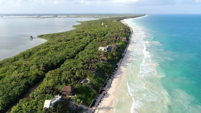 Tulum beach Rivera Maya aerial drone.  Blue clear waters and white sand beaches in a tropical landscape aerial drone view. Awesome high aerial drone view in the Yucatan Peninsula on the Caribbean Sea.