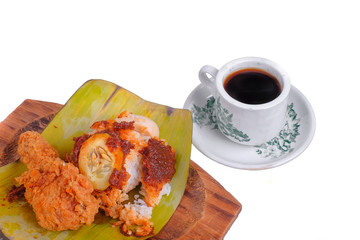 Nasi lemak is a traditional Malay rice cooked in coconut milk with pandan leaf .  Wrapped in banana...