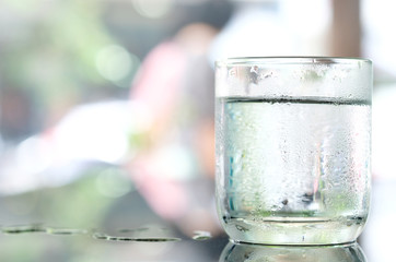 Drink Water cool.  Pure water in the glass on the table. Health concept