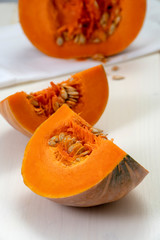 Sliced pumpkin on white table