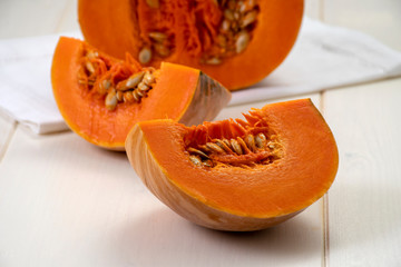 Sliced pumpkin on white table