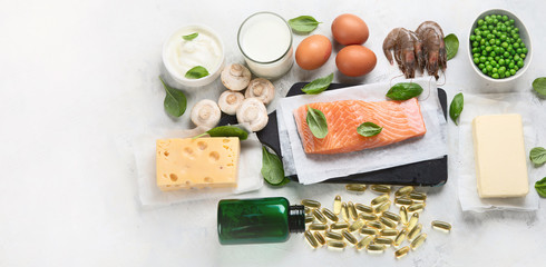 Vitamin D foods and capsulas. For Eye, bone and immune systems health, blood pressure regulation. Against cancer; Prevent memory and brain decline; Panorama, banner