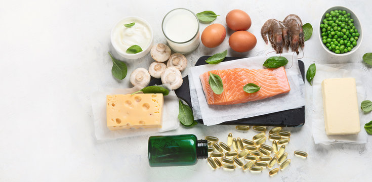 Vitamin D foods and capsulas. For Eye, bone and immune systems health, blood pressure regulation. Against cancer; Prevent memory and brain decline; Panorama, banner