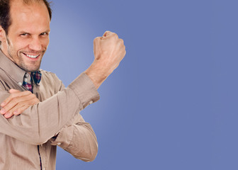 young man showing cubital sign. Synonym sign of middle finger. on blue color background