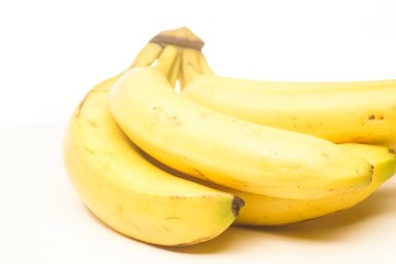 Yellow fresh banana isolated against white, selective focusing