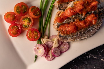  fresh sardines with tomato sauce and other vegetables