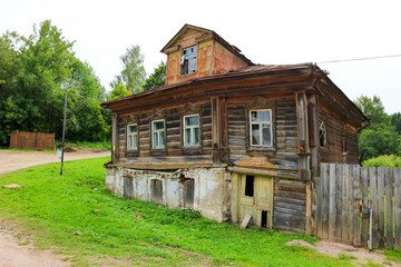 Fototapeta na wymiar old wooden abandoned house in small russian town