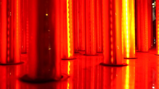A close-up view of red lights that create a beautiful harmony in this background. The pattern continues in a loop during the whole night.
