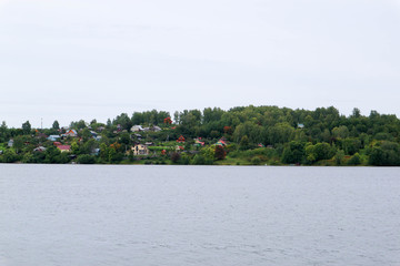 View of majestic volga river with the village on other side