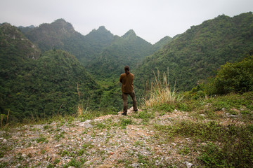 A lone traveler marveling at the foggy mountains of Lang son, Vietnam