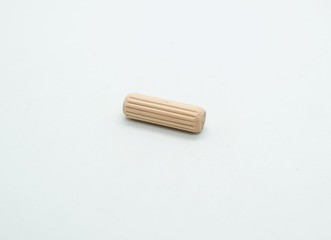 Normal size wooden dowel pin isolated on white background.