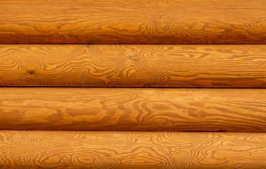 rough wooden timber background , brown and orange log wall texture , beam walls close up for...