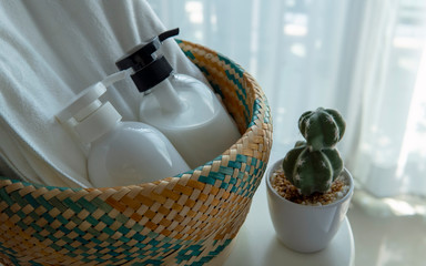 Liquid soap and shampoo bottle on basket.Hygiene and healthy life concept.