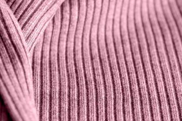 Pink knitwear texture close up. Textile background