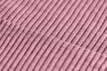 Pink knitwear texture close up. Textile background