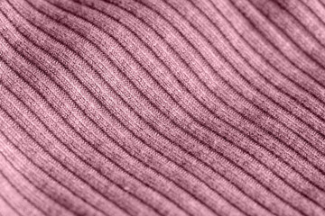 Pink knitwear texture close up. Textile background