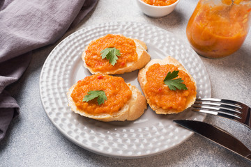 Sandwiches with bread zucchini caviar tomatoes onions. Homemade vegetarian food. Copy space.
