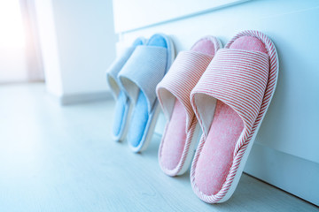 Family home cozy soft comfortable slippers. Family concept, female and male slippers