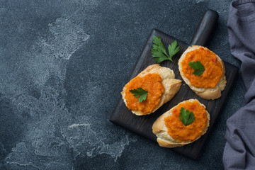 Sandwiches with bread zucchini caviar tomatoes onions. Homemade vegetarian food. Copy space.