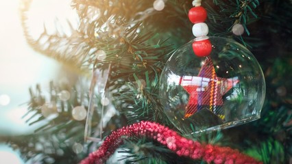 Red star in circle glass hanging on christmas tree with copy space, decorative for christmas xmas new year festival holiday .