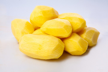 Peeled potato isolated on white background