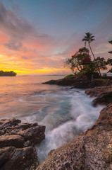 sunset on coast of sea