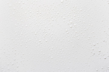 Raindrops on a grayish white background. Rainy season concept.