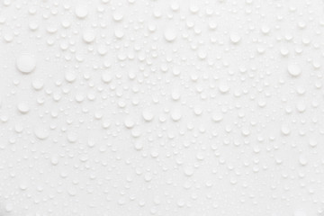 Raindrops on a grayish white background. Rainy season concept.