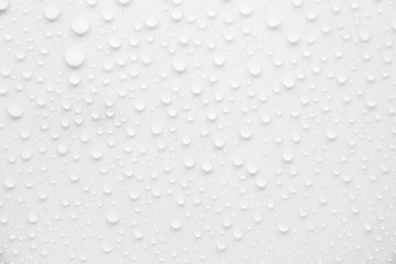 Raindrops on a grayish white background. Rainy season concept.