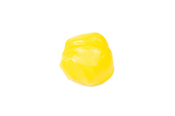 Yellow plasticine, isolated on white background.