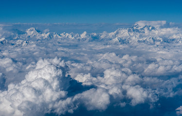 Fototapeta premium Above the clouds in Himalayas mountain range, Nepal