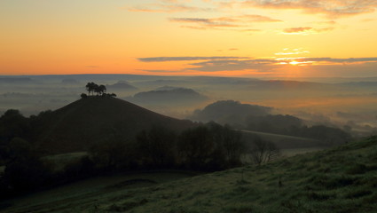 Misty morning over Collmer's Hill in the Dorset Area of Outstanding Natural Beauty (AONB).
