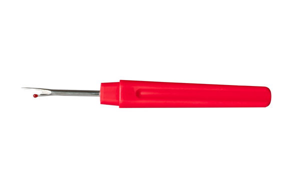 Seam ripper  with red plastic handle isolated on white background with clipping path