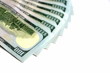One hundred dollars. Money. Paper bills in denominations of one hundred dollars. Business and...