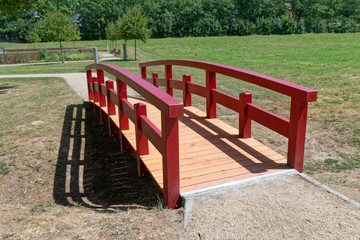 A small wooden bridge in the park.