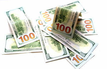 One hundred dollars. Money. Paper bills in denominations of one hundred dollars. Business and...