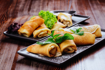 Delicious Tasty Homemade crepes or pancakes with raspberries and blueberries for breakfast