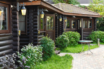Country holidays in wooden houses. A cozy place for a family holiday in the cabins.
