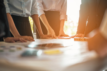 Office workers are meeting to plan a new financial project. Teamwork, teamwork ideas for business...