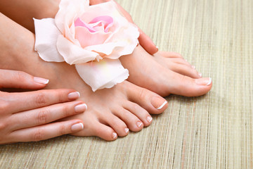 Closeup photo of a beautiful female feet with pedicure