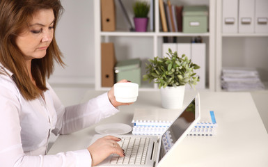 Young businesswoman working on a laptop