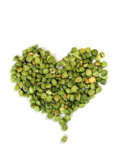  Dry green peas on a white background. Pea texture.  Chipped dry peas for soup.