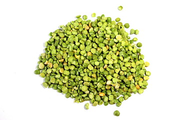  Dry green peas on a white background. Pea texture.  Chipped dry peas for soup.