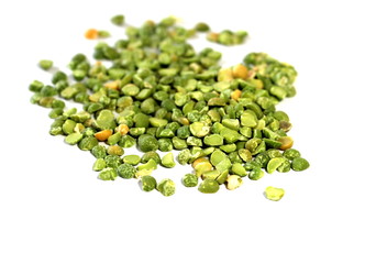  Dry green peas on a white background. Pea texture.  Chipped dry peas for soup.