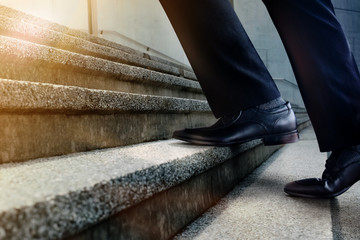 Motivation and challenging Career Concept. Steps Forward into a Success. Low Section of Businessman...