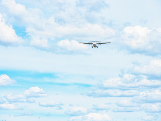 A commercial passenger airplane coming in for landing at Canberra airport, Australia on a sunny afternoon       