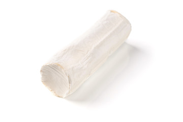 Stick of a goat cheese isolated over the white background