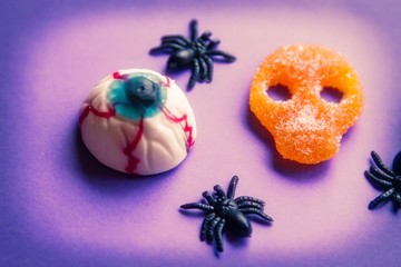 halloween candies seen close up on purple background